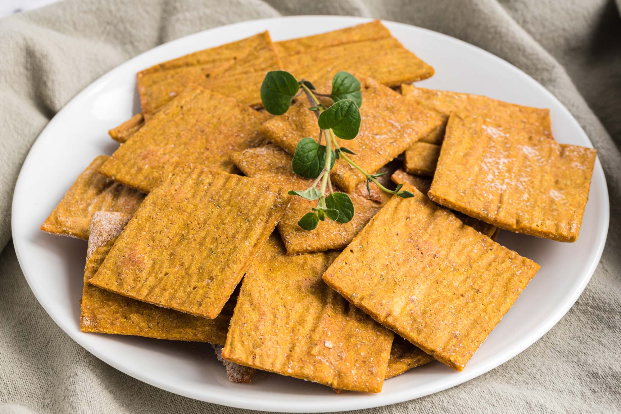 easy cheesy herbed crackers on plate