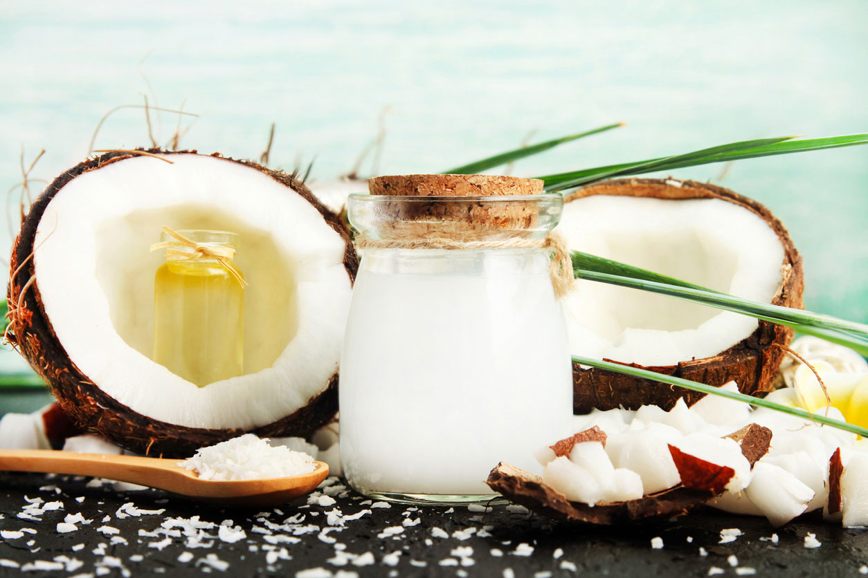 coconut milk glass jar with shavings and coconut halves