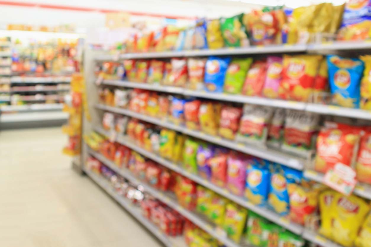 blurry shot of chip aisle at grocery store